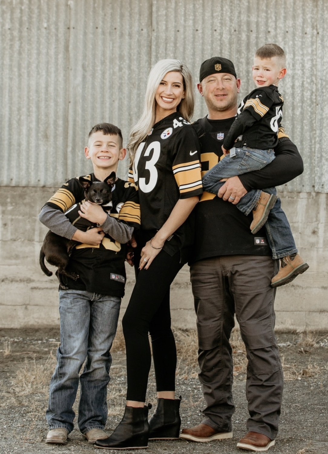 Stefanie with her family in matching sports jerseys